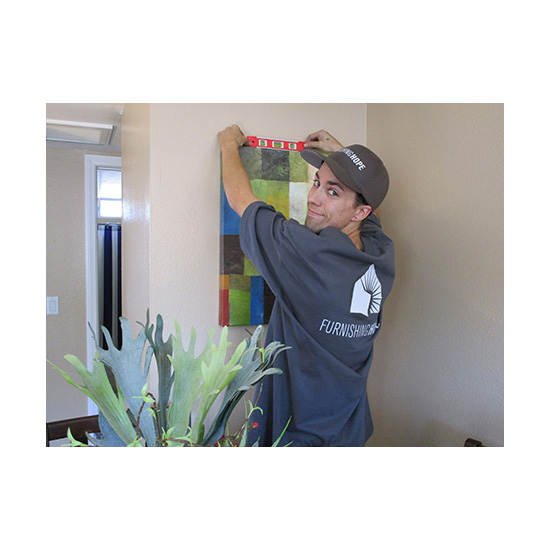 Furnishing Hope team member hanging wall art