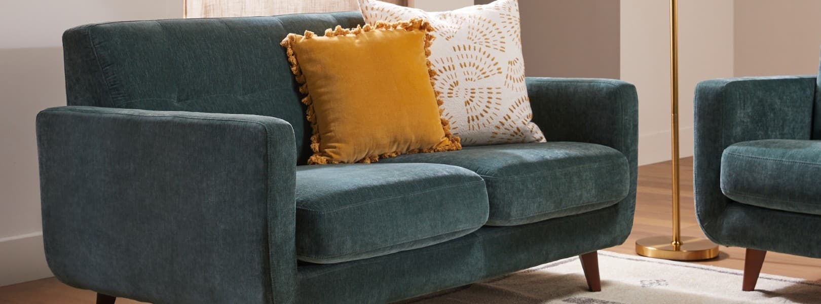 dark green sofa yellow pillow living room